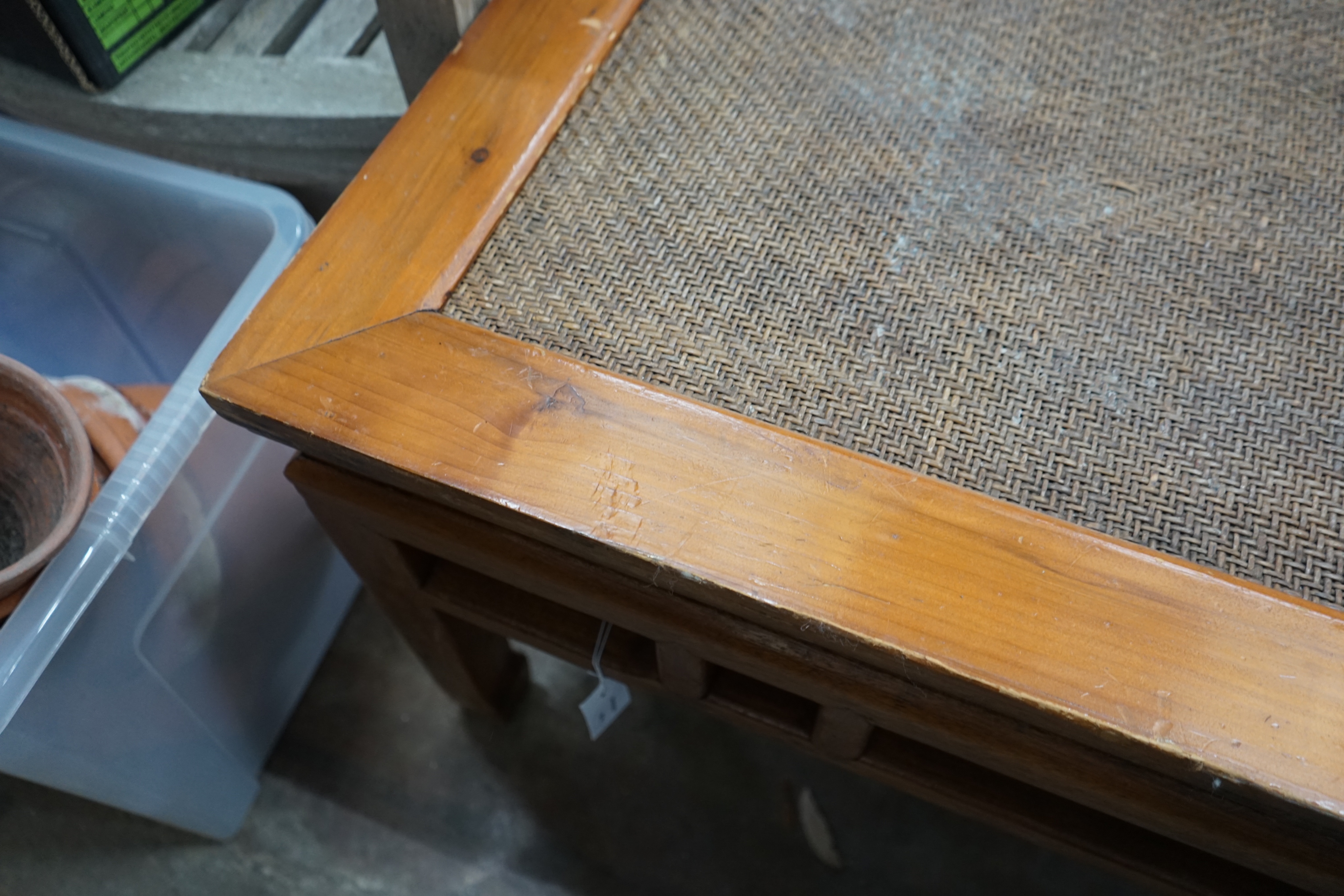 A Chinese caned pine and hardwood square low table, width 97cm height 51cm